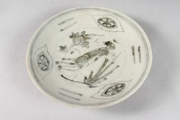 A CHINESE SHIPWRECK PORCELAIN DISH, with central bird and peach design, 20.5cm diameter.