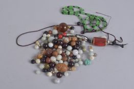 A COLLECTION OF MIXED ORIENTAL BEADS, (qty).