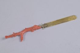 A VERY FINE 19TH CENTURY CARVED CORAL AND GILT METAL PAGE TURNER, 20cm long.