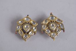A PAIR OF 19TH CENTURY INDIAN ENAMELLED GOLD EARRINGS, set with clear stones.