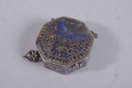 A 19TH CENTURY PERSIAN GILDED AND ENAMELLED SILVER BAZUBAND, 5.5cm wide.