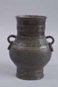 A 19TH CENTURY CHINESE BRONZE ZHU VASE., 24cm high.