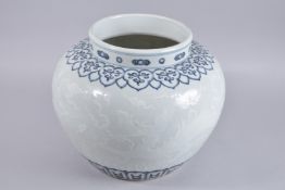 A VERY LARGE CHINESE BLUE AND WHITE CARVED KUI DRAGON JAR, 30cm high.
