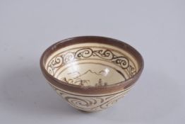 A CHINESE CIZHOU POTTERY TEA BOWL.