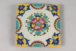 A 19TH CENTURY PERSIAN GLAZED POTTERY TILE, 20cm square.