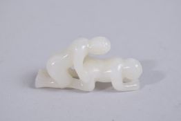 A VERY FINE CHINESE EROTIC JADE CARVING, 5cm long.