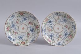 A PAIR OF 18TH CENTURY CHINESE FAMILLE ROSE PORCELAIN DISHES, painted with floral motifs, 20cm