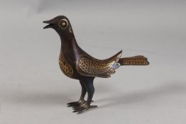 A PERSIAN QAJAR GOLD INLAID STEEL BIRD, 15.5cm high.