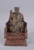 AN 18TH-19TH CENTURY CHINESE CARVED AND PAINTED WOODEN EMPEROR AND THRONE, in two pieces with the