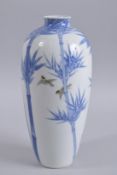 A TALL JAPANESE ARITA BLUE AND WHITE PORCELAIN VASE, decorated with bamboo and polychrome