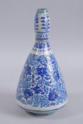 A FINE 18TH CENTURY NORTH INDIAN MULTAN POTTERY BOTTLE VASE, signed at the base, 30cm high.