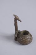 A BRONZE OKIMONO OF A BIRD AND BAMBOO BASKET.