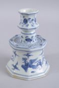 A CHINESE BLUE AND WHITE PORCELAIN OCTAGONAL CANDLESTICK, with phoenix and lotus, 20.5cm high.