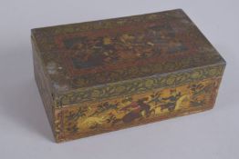A FINELY PAINTED 19TH CENTURY PERSIAN QAJAR WOODEN BOX, with hunting scenes, 17cm wide.