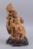 A LARGE CHINESE CARVED WOOD FIGURE OF SHAO LAO AND A CHILD, with dragon and crane upon his staff,