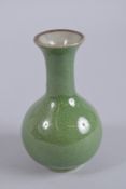 A CHINESE GREEN CRACKLE GLAZE PORCELAIN VASE, 14cm high.