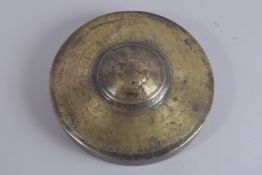 A 19TH CENTURY INDIAN BRASS ENCASED CIRCULAR MIRROR WITH PAINTED SCENE TO INTERIOR, the painting