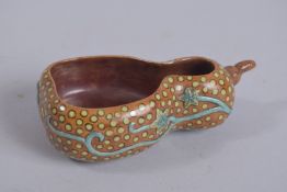 A CHINESE GOURD SHAPE PORCELAIN BRUSH WASHER, with character mark to base, 13cm long.