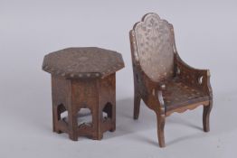 AN UNUSUAL 19TH CENTURY INDIAN HOSHIAPUR BRASS INLAID MINIATURE WOODEN TABLE AND ARMCHAIR,