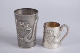 TWO CHINESE HALLMARKED SILVER DRAGON CUPS, tallest 11cm high, (2).