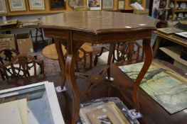 An Edwardian inlaid rosewood shaped top two-tier occasional table.