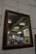A wall mirror with chinoiserie decorated frame.