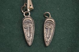 A pair of decorative pendants.