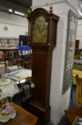 A 19th century oak longcase clock with eight day movement, the arched brass dial signed Francis