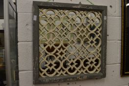 A pair of lattice work mirrors with grey painted frames.