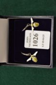 A pair of sterling silver and enamel bee shaped earrings.