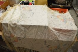 An embroidered shawl.