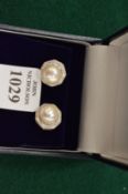 A pair of sterling silver, cultured pearl and crystal ear studs.