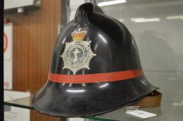 An Admiralty Fire Service helmet.
