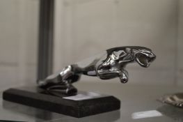 A reproduction Jaguar car mascot.