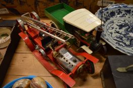 A Mamod fire engine and a Mamod steam truck.