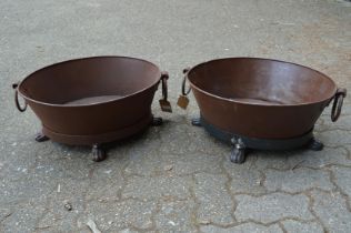 A pair of wrought iron oval twin handled planters.