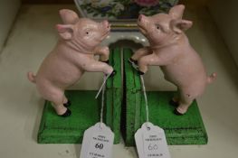 A pair of novelty cast iron pig bookends.