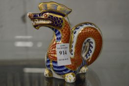 A Royal Crown Derby model of a dragon.