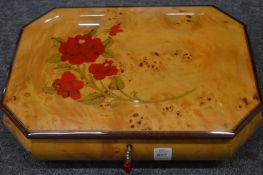 A burr wood musical jewellery box.