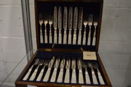 A good cased set of twelve mother of pearl handled fruit knives and forks.