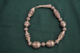 An Eastern silver necklace.