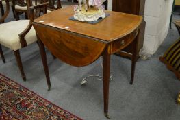 A Georgian mahogany and rosewood cross banded sofa table.