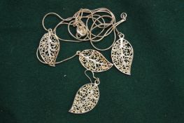 A silver leaf shaped pendant and chain etc.