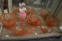 A large collection of pink glass dishes etc.