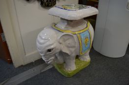 A decoratively painted pottery elephant seat.