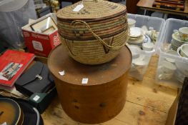 A large wooden hat box and a wicker basket.