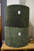 A pair of green velvet lamp shades.