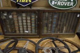 A small wall mounted cabinet containing numerous old car bulbs by Lumaz, Lucas, Philips etc.