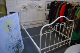 A Victorian style white painted and polished brass 4ft bed frame.