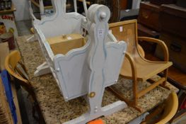 A painted crib, towel rail etc.